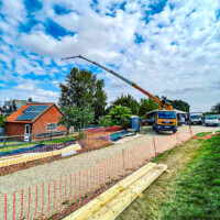 Bocker mobile truck crane lifting at residential property