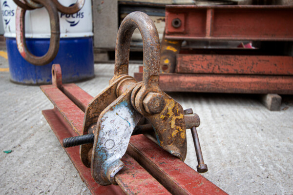 close up of specialist mobile crane clamp on metal beam