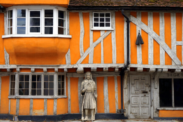An old orange Tudor residential house in Hertfordshire with timber beams