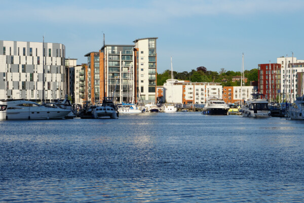 Ipswich marina on a summers day with residential apartments in the background