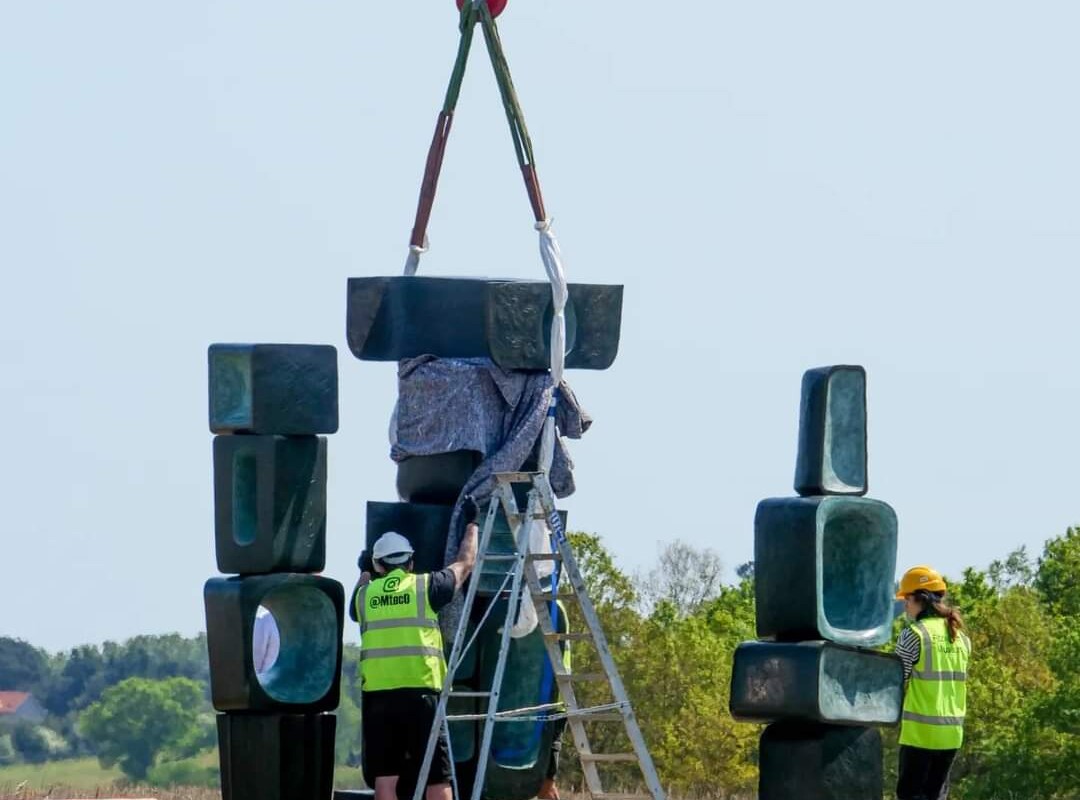 sculptures being installed