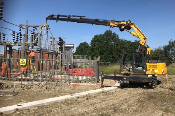 Compact crawler crane on utilities site