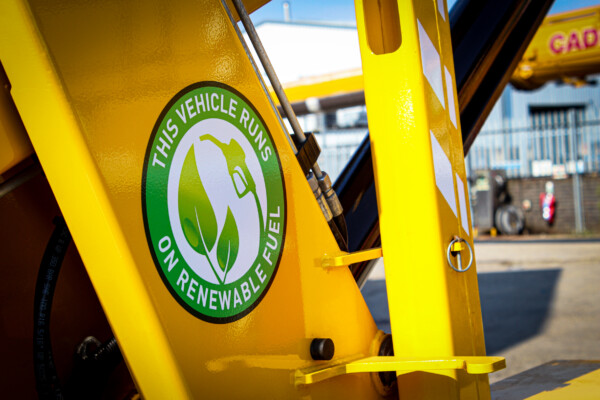 close up of renewable fuel sticker on yellow crane spider crane boom