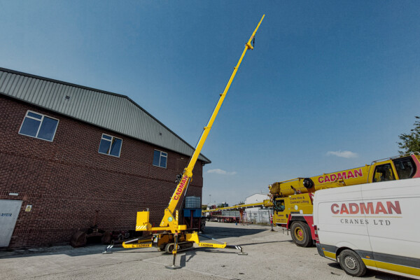 hoeflon c10 spider crane set up in yard with fly jib extended
