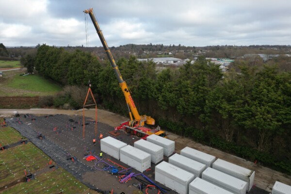Crane lifting battery storage unit